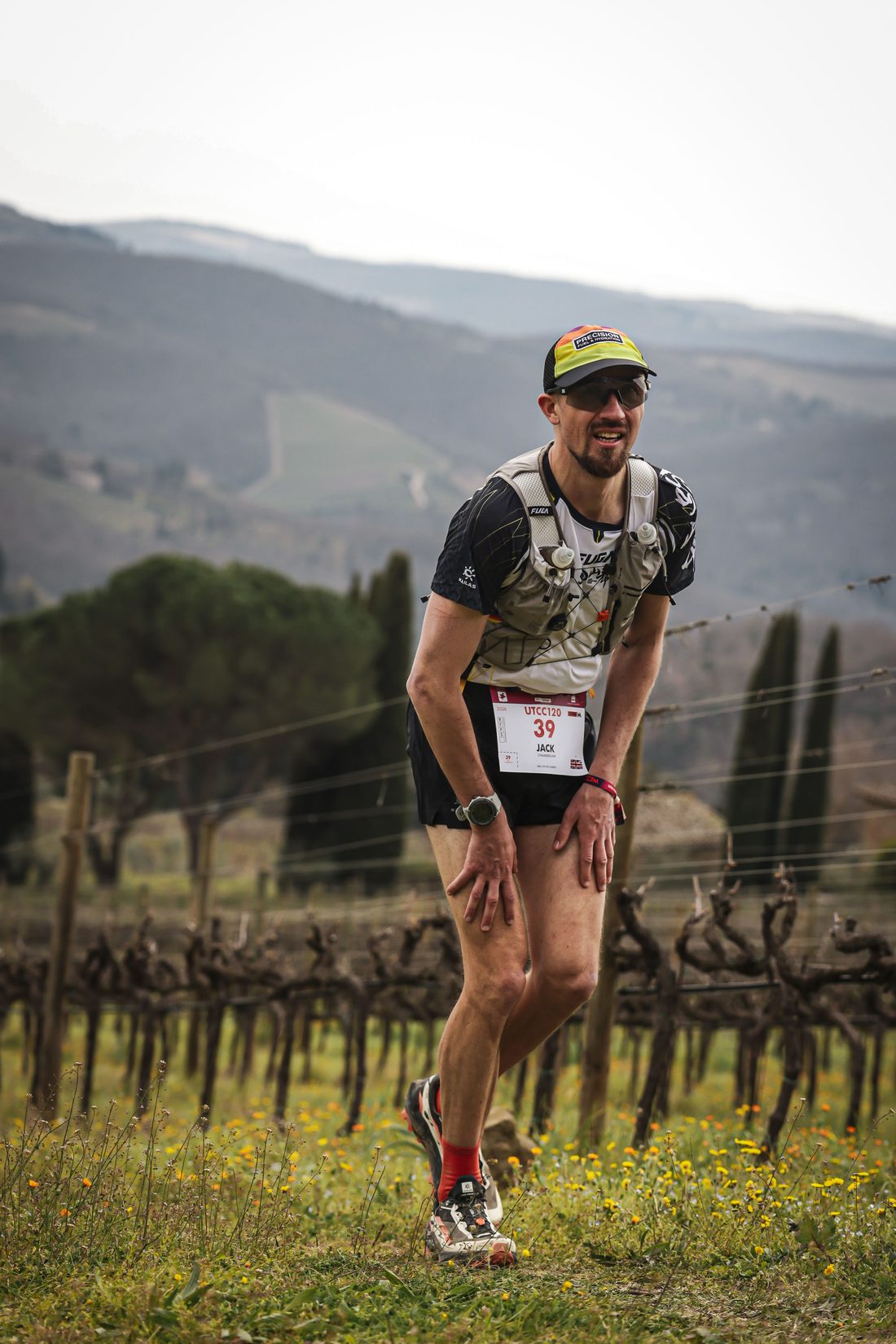 Jack Chamberlain running through a Tuscan vineyard at the Chianti Ultra Trail.