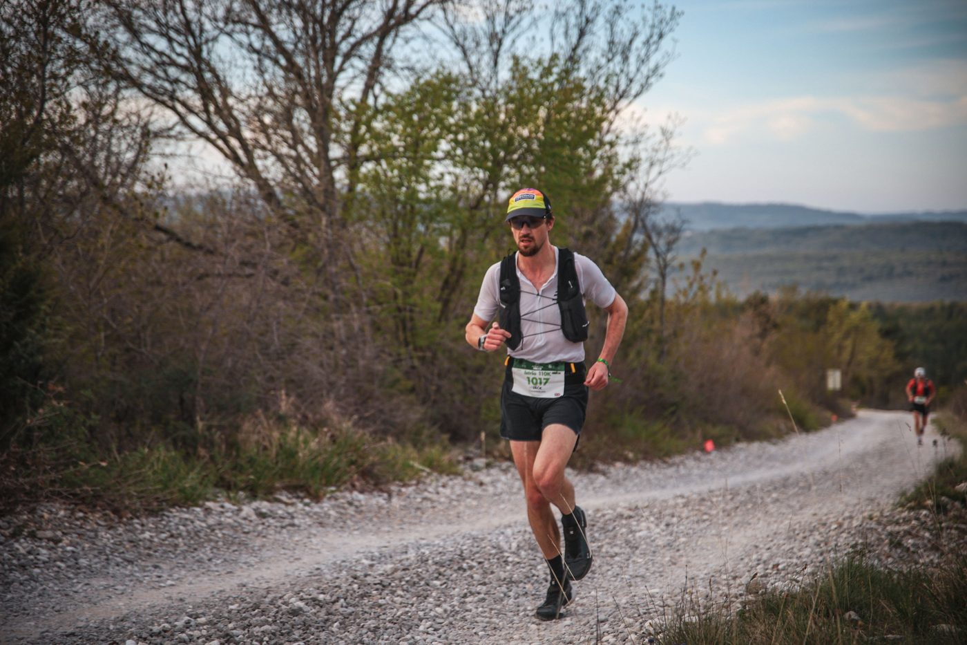 Jack Chamberlain running a gravel road through the hills of Istria.